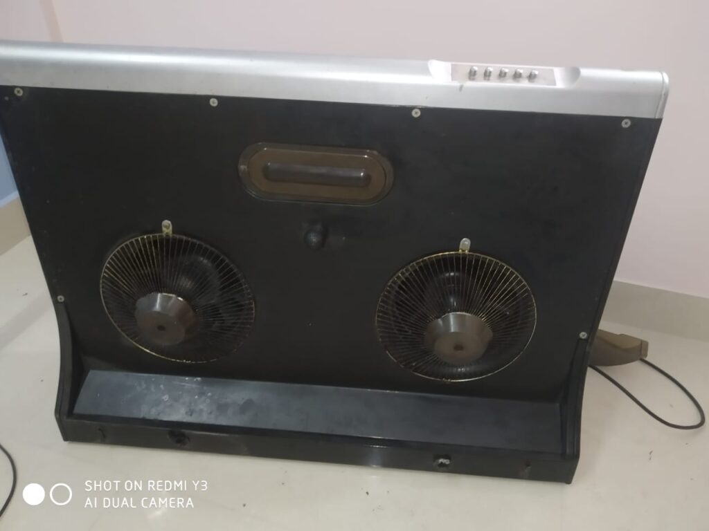 Kutchina chimney opened for repair showing blower and motor, Kolkata