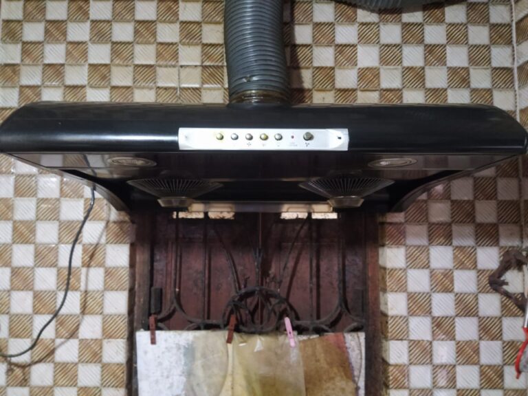 Services 3 Kitchen chimney fitted with flexible ducting in a home kitchen