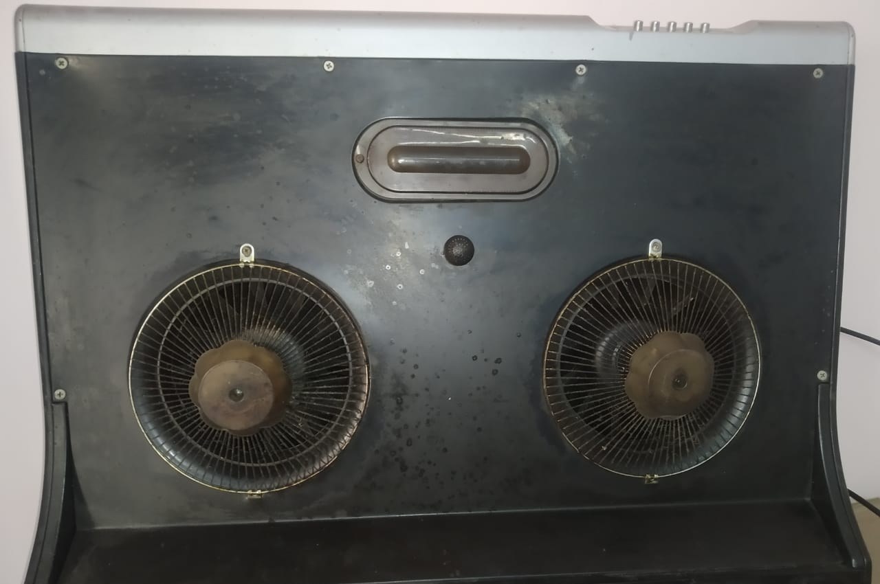 Kutchina Chimney Repair in Kolkata — Doorstep Repair from ₹650 2 Dismantled kitchen chimney hood with twin blower fans and grease build-up